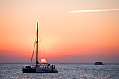 Spain, Balearic Islands, Ibiza island, Sant Antoni, sunset in front of the Cafe del Mar