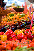 France, Alpes Maritimes, Menton, market in front of the municipal covered market, red peppers and eggplants