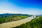 Boats on river near village