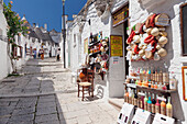 Souvenir shop on street of Trulli, traditional houses, Rione Monti area, Alberobello, UNESCO World Heritage Site, Valle d'Itria, Bari district, Puglia, Italy, Europe