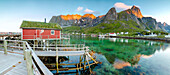 Panoramic of the fishing village surrounded by sea and midnight sun, Reine, Nordland county, Lofoten Islands, Arctic, Northern Norway, Scandinavia, Europe