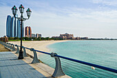 View from the Breakwater towards Etihad Towers and Emirates Palace Hotel and beach, Abu Dhabi, United Arab Emirates, Middle East