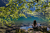 Woman on the Lake shore, Obersee, Koenigssee, Berchtesgaden, Bavaria, Germany.