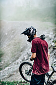 Portrait of a young Mountainbiker, Mountainbike, Hut, Brandnertal, Vorarlberg, Austria