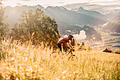 Mountainbiker within the mountains at sunrise, Brandnertal, Vorarlberg, Austria, Alps, Mountains, Downhill