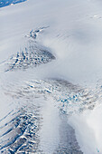 Aerial view of snow and ice that comprises the Harding ice field, crevasses visible in the foreground, Kenai Peninsula, Seward, Alaska, United States of America