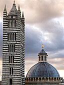 Dome roof and striped tower of Siena Cathedral, Siena, Italy