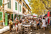 people in the sidewalk cafes of Arta, Mallorca, Balearic Islands, Spain