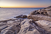 Rocky coast in evening light near Calvi, Corsica, Southern France, France, Southern Europe