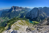 View towards Wetterstein range with Zugspitze and lake Seebensee, from Ehrwalder Sonnenspitze, Mieming range, Tyrol, Austria
