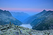 Cairn above barrier lake Zillergrund, hut Plauener Huette, Zillergrund, Reichenspitze group, Zillertal Alps, Tyrol, Austria