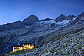 Illuminated hut Plauener Huette with Kuchelmooskopf and Reichenspitze, hut Plauener Huette, Reichenspitze group, Zillertal Alps, Tyrol, Austria