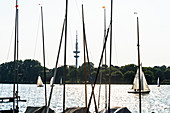 Sailing boats on lake Aussenalster with television tower in the background, Hamburg, Germany