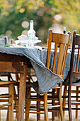 Tablecloth on empty table blowing in wind