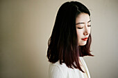 Pensive Asian woman