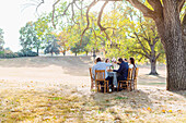 Friends eating at outdoor table