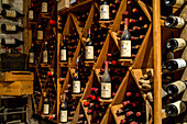 bottles in wine cellar, Barolo area of Langhe, Piedmont, Italy
