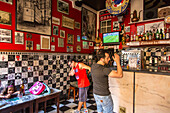 football fans watching European Cup in TV in a bar, Lisbon, Portugal