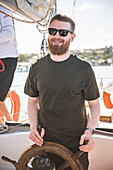 Tourist on a sailing boat trip in the Bay of Islands, from Russell, Northland Region, North Island, New Zealand, Pacific