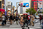 Crowds crossing a street in the Ginza district in the evening, Tokyo, Japan, Asia