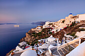 View of the Aegean Sea from the typical Greek village of Oia at dusk, Santorini, Cyclades, Greek Islands, Greece, Europe