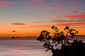 A dawn sky above the Alderman Islands in the South Pacific from New Zealand's Coromandel Peninsula, Waikato, North Island, New Zealand, Pacific