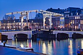 Netherlands, Amsterdam, Magere Brug, the Skinny Bridge, dusk.