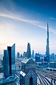 UAE, Dubai, Downtown Dubai, eleavted view over Sheikh Zayed Road and Burj Khalifa Tower, world's tallest building, 2016, dawn.