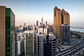 UAE, Abu Dhabi, elevated skyline from Corniche Road East, dawn.