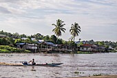 Small fishing boats along the river bank of Dalat, Sarawak, Malaysia