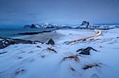 Road lights in the snowy landscape of Myrland. Lofoten Islands Northern Norway Europe.