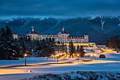 Mount Washington Hotel covered in snow at Twilight, Bretton Woods, New Hampshire.