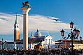 St Mark's Square and San Giorgio Maggiore during Venice Carnival. Venice, Veneto, Italy.