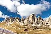 Blue sky and clouds on the high rocky peaks at Gardena Pass South Tyrol Trentino Alto Adige Italy Europe.