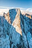 Aerial shot of the north face of Piz Badile located between Masino and Bregaglia Valley border Italy Switzerland Europe.