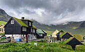 The village Gasadalur. The island Vagar, part of the Faroe Islands in the North Atlantic. Europe, Northern Europe, Denmark, Faroe Islands.
