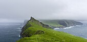 The island Mykines, seen from Mykinesholmur, part of the Faroe Islands in the North Atlantic. Europe, Northern Europe, Denmark, Faroe Islands.