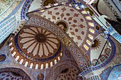 Sultan Ahmed or Blue Mosque interior and domes Istanbul , Turkey.