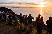 tourists on the summit of Stromboli Volcano at sunset, Stromboli Island, Aeolian Islands, Lipari Islands, Tyrrhenian Sea, Mediterranean Sea, Italy, Europe