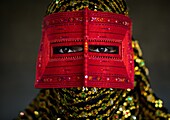 Iran, Hormozgan, Minab, a bandari woman wearing a traditional mask called the burqa.