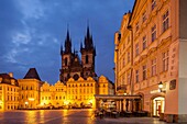 Dawn at old town square in Prague, Czech Republic. Our Lady before Tyn church in the distance.