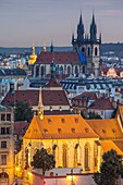 Night falls over Prague old town, Czech Republic. Our lady before Tyn church dominates the skyline.
