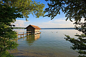 Wooden boathouse in Ammer lake. Upper Bavaria. Germany.