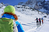 Several persons backcountry skiing ascending towards Manndlkogelscharte, Manndlkogelscharte, Gosau group, Dachstein, UNESCO World Heritage Site Salzkammergut-Dachstein, Salzburg, Austria