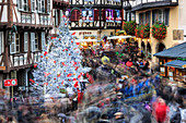 Christmas tree and Santa Claus in the pedestrian roads of the old town, Colmar, Haut-Rhin department, Alsace, France, Europe