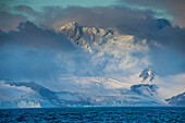 Mountain breaking through the clouds, Elephant Island, South Shetland Islands, Antarctica, Polar Regions