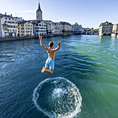 Man jumping into River Limmat, Zurich, Switzerland
