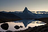 The Matterhorn reflected in lake stellisee the last light of sunset, Zermatt valley, Valais, Wallis Canton, Switzerland