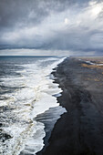 Aerial view of the long black sand beach of Reynisfjara, Vik, Sudurland, Iceland, Europe