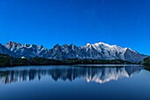The Mont Blanc mountain range reflected in the waters of Lac de Chesery, Haute Savoie France